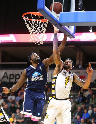 Julian Boyd of the Lightning banks one in off the boards while being guarded by Rhamel Brown of the Halifax Hurricanes during the first half of game four of the NBL finals at Budweiser Gardens in London, Ont. 
Photograph taken on Saturday May 12, 2018. 
Mike Hensen/The London Free Press/Postmedia Network