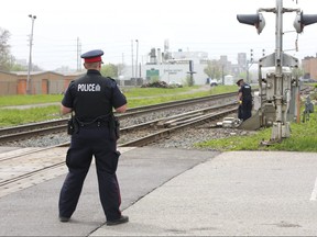 Police investigate after a man was struck by a train  near Maitland Street south of York Street in London, Ont. on Monday, May 14, 2018. (DEREK RUTTAN, The London Free Press)
