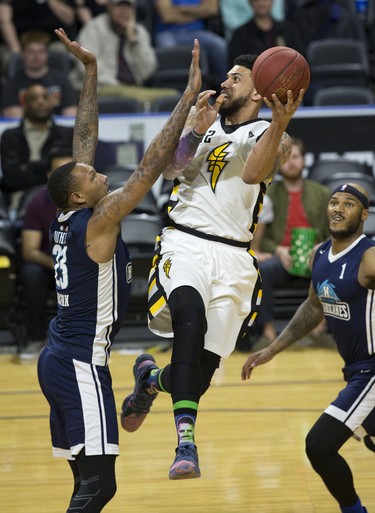 Julian Boyd of the London Lightning jumps to make a shot over Billy White of the Halifax Hurricanes during their playoff game at Budweiser Gardens in London on Monday, May 14. Derek Ruttan/The London Free Press