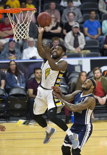 Kyle Johnson of the London Lightning makes a layup while covered by Tyrone Watson of the Halifax Hurricanes during their playoff game at Budweiser Gardens in London on Monday, May 14. Derek Ruttan/The London Free Press