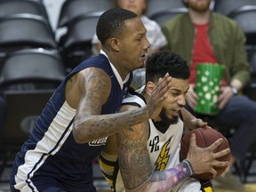 Julian Boyd of the London Lightning leans into Billy White of the Halifax Hurricanes during their playoff game at Budweiser Gardens in London on Monday, May 14. Derek Ruttan/The London Free Press