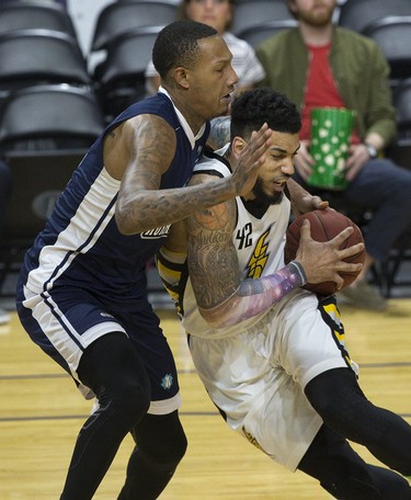Julian Boyd of the London Lightning leans into Billy White of the Halifax Hurricanes during their playoff game at Budweiser Gardens in London on Monday, May 14. Derek Ruttan/The London Free Press