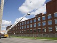 A man takes a selfie after being rescued from the room of the former Kellogg building on Dundas Street in London. on Tuesday, May 15. Firefighters, police and paramedics responded to a fire inside the former cereal factory. (Derek Ruttan/The London Free Press)