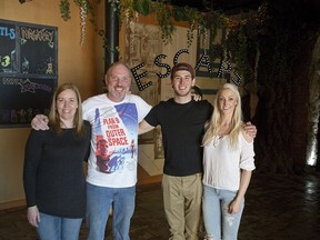 Rebecca and David Korhonen, Shawn Nagy and Emily Lyons are co-owners of Escape Canada at 335 Richmond Street in London. (Derek Ruttan/The London Free Press)