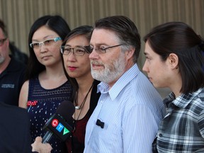 Mona Lam-Deslippe and Tim Deslippe, the parents of Nathan Deslippe, speak with reporters outside the London courthouse with daughter Jessica, right, and family friend Kaitlyn Chau, left, on Thursday. William Joles was found guilty of second-degree murder Thursday in the Aug. 28, 2016, death of Deslippe. (DALE CARRUTHERS / THE LONDON FREE PRESS)