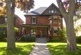 197 Elmwood with mature trees out front and geraniums on the porch for Geranium Walk Tour in London. (Mike Hensen/The London Free Press)