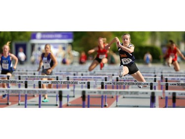 Olivia Gee of Strathroy DCI wins her heat in the senior girls 100m hurdles on Thursday, the first day of WOSSAA track and field at TD stadium in London. Gee, a junior, moved up to senior to take advantage of the move up to 100m from the 80m that the juniors run. Mike Hensen/The London Free Press