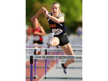 Olivia Gee of Strathroy DCI wins her heat in the senior girls 100m hurdles on Thursday, the first day of WOSSAA track and field at TD stadium in London. Gee, a Grade 10 junior, moved up to senior to take advantage of the move up to 100m from the 80m that the juniors run. Mike Hensen/The London Free Press