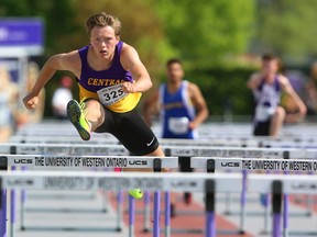 Liam Mather of Central wins his heat in the senior boys 110m hurdles on the first day of WOSSAA track and field at TD stadium in London, Ont.  Mather who won gold at OFSAA last year in the event, hopes to go to the IAAF world juniors this summer in Finland. Photograph taken on Thursday May 24, 2018.  Mike Hensen/The London Free Press/Postmedia Network