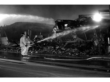 Firefighters work on the fire that destroyed the former Hooks Restaurant in London, Ont. on Wednesday May 30, 2018. Derek Ruttan/The London Free Press/Postmedia Network