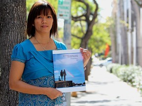 Ima Matul is the survivor coordinator at the Coalition to Abolish Slavery and Trafficking, one of the oldest anti-trafficking oranizations in the United States. Matu, a member of the United States advisory council on human trafficking, is shown holding a copy of the group's most recent report. (DALE CARRUTHERS / THE LONDON FREE PRESS)