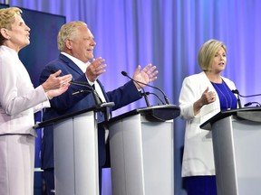 Ontario Liberal Leader Kathleen Wynne, left, Ontario Progressive Conservative Leader Doug Ford, and Ontario NDP Leader Andrea Horwath take part in the the third and final televised debate of the provincial election campaign in Toronto on Sunday. Frank Gunn/The Canadian Press