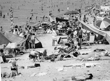 Sun bathers set up temporary tents to get out of the sun at Pinery Provincial Park, 1966. (London Free Press files)