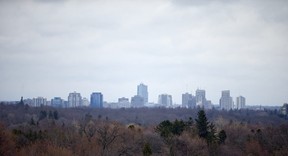 Rain clouds slowly move over the downtown skyline as seen here from Scenic View Park in west London, Ontario on Monday April 14, 2014. CRAIG GLOVER/The London Free Press/QMI Agency