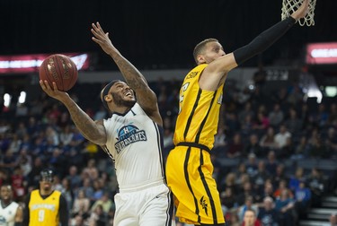 Halifax Hurricanes forward Tyrone Watson takes a shot over London Lightning forward Garrett Williamson during the first half of Thursday night’s NBL Canada playoff game in Halifax. The Hurricanes led the Lightning 55-53 at the half.
(RYAN TAPLIN / The Chronicle Herald)