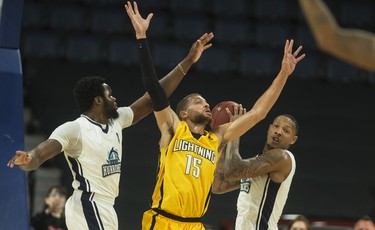 Halifax Hurricanes forward Billy White beats London Lightning forward Garrett Williamson to a rebound during the first half of Thursday night’s NBL Canada playoff game in Halifax. The Hurricanes lead the Lightning 55-53 at the half.
(RYAN TAPLIN / The Chronicle Herald)