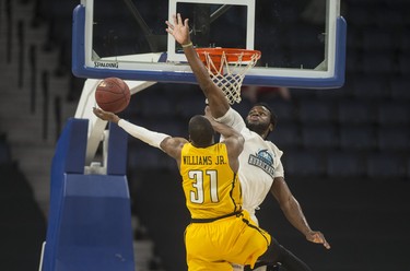 Halifax Hurricanes centre Rhamel Brown defends against London Lightning forward Kirk Williams Jr. during the first half of Friday night’s NBL Canada playoff game in Halifax. The Lightning led the Hurricanes 57-53 at the half.
(RYAN TAPLIN / The Chronicle Herald)