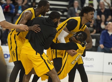 London Lightning guard Doug Herring Jr. is mobbed by his teammates after hitting a buzzer beater to wrap up the first half during Friday night’s NBL Canada playoff game in Halifax. The Lightning led the Hurricanes 57-53 at the half.
(RYAN TAPLIN / The Chronicle Herald)