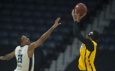 London Lightning guard Doug Herring Jr. shoots over Halifax Hurricanes forward Billy White during the first half of Friday night’s NBL Canada playoff game in Halifax. The Lightning lead the Hurricanes 57-53 at the half.
(RYAN TAPLIN / The Chronicle Herald)