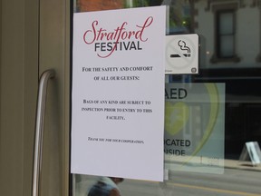 A sign outside the Avon Theatre advises patrons of a bag-check policy being implemented after Monday's bomb threat at the Stratford Festival.
(JONATHAN JUHA/POSTMEDIA NETWORK)