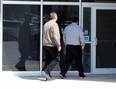 Josh Alexander, right, enters the provincial courthouse on Tuesday in Stratford. Terry Bridge/Stratford Beacon Herald/Postmedia Network