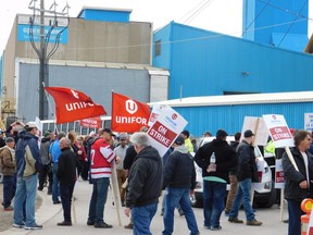 Strikers walk the picket line at Compass Minerals' Goderich salt mine Tuesday, May 2. Some 340 workers, members of Unifor Local 16 - O, walked off the job April 27. They have been seeking a new contract since March. (Kathleen Smith/Goderich Signal Star)