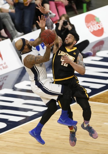 London Lightning’s Julian Boyd fouls Halifax Hurricanes Tyron Watson, who was fast breaking to the hoop, during NBL of Canada playoff action in Halifax Sunday. (Tim Krochak/ The Chronicle Herald)