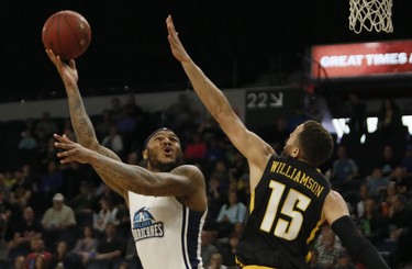 Halifax Hurricanes Tyron Watson lays one up for a deuce against London Lightning’s Garrett Williamson during NBL of Canada playoff action in Halifax Sunday. (Tim Krochak/ The Chronicle Herald)