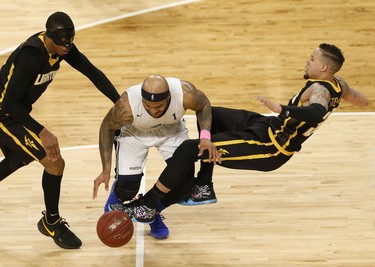 Halifax Hurricanes Tyron Watson, runs over London Lightning’s Joel Friesen-Latty, right, during NBL of Canada playoff action in Halifax Sunday. Watson was given an offensive foul on the play. (Tim Krochak/ The Chronicle Herald)