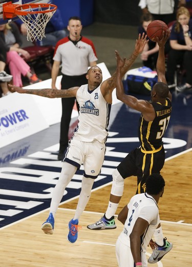 Halifax Hurricanes Billy White, tips a shot by London Lightning’s Kirk Williams Jr., during NBL of Canada playoff action in Halifax Sunday. (Tim Krochak/ The Chronicle Herald)