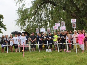 Family and friends of inmates who died at the Elgin Middlesex Detention Centre gathered outside the London jail on Sunday, May 3, 2018, to protest conditions at the problem-plagued facility. The demonstrators plants 13 crosses to represent the d13 inmates who have died in the jail in the past decade. DALE CARRUTHERS / THE LONDON FREE PRESS