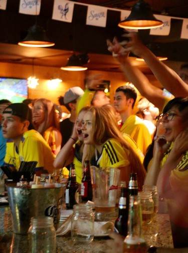 Columbian fans sit on the edge of their seats as they watch Columbia take on Poland in the 2018 FIFA World Cup tournament in Russia. (SHANNON COULTER, The London Free Press)