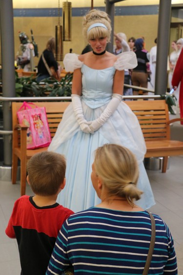 A family talks to Cinderella at Wednesday's Teddy Bear Picnic at London's children's hospital. Several special guests, including Tinker Bell and Star Wars characters, were at the event to meet families and patients. (SHANNON COULTER, The London Free Press)