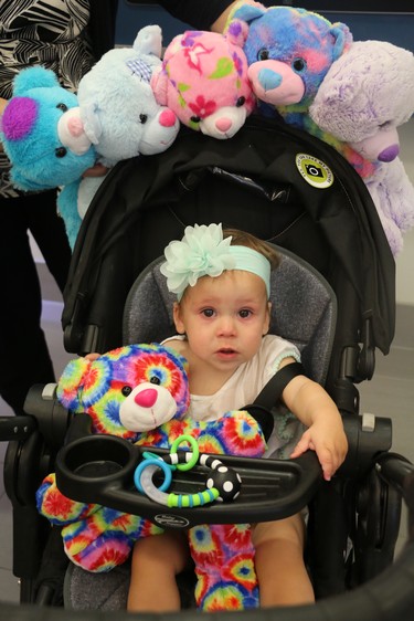 Kate, 11 months old, holds a teddy bear at the Teddy Bear Picnic at the Children's Hospital in London on Wednesday. Each child had the opportunity to make a teddy bear and dress it in an outfit of their choice. (SHANNON COULTER, The London Free Press)