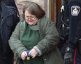 Elizabeth Wettlaufer is escorted from the courthouse in Woodstock, Ont., on Friday, Jan. 13, 2017. Ontario has announced an appeal court judge who will head a public inquiry into the policies, procedures and oversight of long-term care homes after a nurse admitted to killing eight seniors in her care. THE CANADIAN PRESS/Dave Chidley