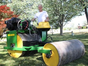Jason Cates stands with his 'Rollinator' lawn roller at his home in Wyoming. The Enbridge worker is one of three finalists in the Princess Auto Ultimate Figure-it-Outer contest. (Tyler Kula/Postmedia Network)