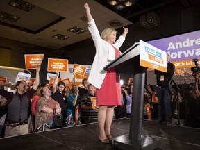 Ontario NDP Leader Andrea Horwath cheers as she arrives at her Ontario provincial election night headquarters in Hamilton on June 7. (Peter Power/The Canadian Press)