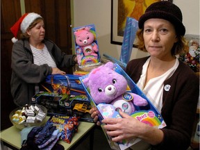 Jacqueline Thompson with volunteer Maureen Caissie and some of the donations to their Christmas  program. (Free Press file photo)