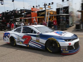 DJ Kennington, driver of the #7 APC Chevrolet, drives through the garage area during practice for the Monster Energy NASCAR Cup Series Firekeepers Casino 400 at Michigan International Speedway on June 8, 2018 in Brooklyn, Michigan.