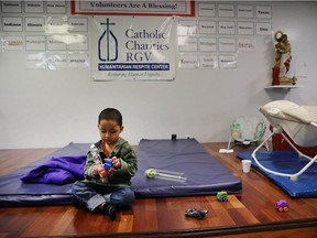 A Honduran child plays at the Catholic Charities Humanitarian Respite Center after recently crossing the U.S., Mexico border with his father on June 21, 2018 in McAllen, Texas. Once families and individuals are released from Customs and Border Protection to continue their legal process, they are brought to the center to rest, clean up, enjoy a meal and get guidance to their next destination. Before Trump signed an executive order yesterday that the administration says halts the practice of separating families seeking asylum, more than 2,300 immigrant children had been separated from their parents in the zero-tolerance policy for border crossers.