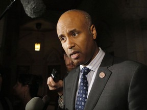 Minister of Immigration, Refugees and Citizenship Ahmed Hussen speaks to reporters outside the House of Commons on Parliament Hill on Thursday, May 31, 2018. (THE CANADIAN PRESS/ Patrick Doyle)