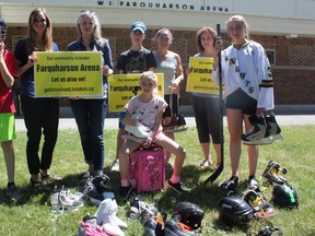 Londoners in Old South are rallying to save the ice pads at Farquharson arena, which they say is an integral part of the community. (L-R) James Colquhoun, Lisa Conley, Lisa Nelson, Ethan Saunders, Isabella Colquhoun, Heather Saunders, Lori-Ann Pizzolato and Keira Hurry all skate at the arena or help to run free community skating events. (MEGAN STACEY/The London Free Press)