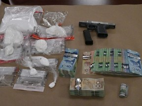 Two men face charges after police seized cocaine, cash and a handgun during a half dozen raids in London on Thursday. (Police supplied photo)