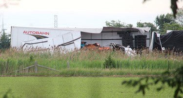 Highway 401 was closed in both directions after two tractor trailers collided head-on when one of the rigs crossed the median on Highway 401, just east of the westbound Tilbury OnRoute service centre near Tilbury, Ont., on Friday June 22, 2018, just before 7 a.m.  (Ellwood Shreve/Postmedia Network)