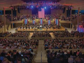 Conductor Stuart Chafetz acknowledges the audience during the Chautauqua Symphony Orchestra’s annual Independence Day pops concert, last year in the Chautauqua Institution's amphitheatre. (Chautauqua Institution photo)