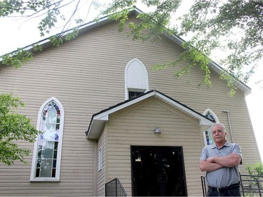 Bryan Prince, a descendant of the original settlers of North Buxton, stands in front of the North Buxton Community Church, that is being taken over by the British Methodist Episcopal Church of Canada. Ellwood Shreve/Postmedia Network