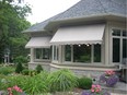 Retractable window awnings by London Awnings.