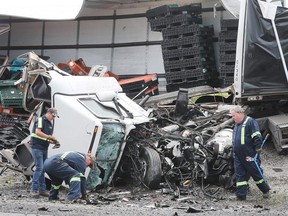 The wreckage of a collision between two tractor-trailers is shown on Friday, June 22, 2018 on Highway 401 near Tilbury, ON. One driver was killed and the other is in serious condition. The accident occurred just before 7:00 a.m. and shut down all lanes of the highway for several hours. (DAN JANISSE/THE WINDSOR STAR)