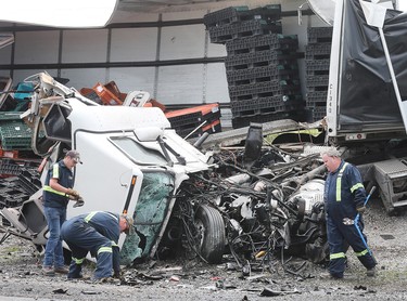 The wreckage of a collision between two tractor-trailers is shown on Friday, June 22, 2018 on Highway 401 near Tilbury, ON. One driver was killed and the other is in serious condition. The accident occurred just before 7:00 a.m. and shut down all lanes of the highway for several hours. (DAN JANISSE/THE WINDSOR STAR)