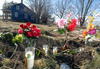 A memorial in Hampstead, northeast of Stratford, on Wednesday, Feb. 8, 2012 marked the site of the collision that killed a London trucker and 10 migrant workers. File photo